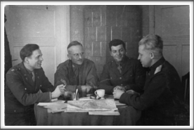 Meeting with officers of the Allied Army of USA during the liberation of the Szubin camp  January 25, 1945.  Pictured l-r:  Dr. Floyd Burgeson, Father Stanley Brach, Seymour Bolten, Russian General Alexander Kotikow