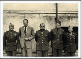 L-R:  Senior American Officer Colonel T. Drake; Lt. Colonel W. Schaeffer; Lt. Colonel J. Waters, Major M. Meacham. Dr. Mayer from the International Red Cross is in plain clothes