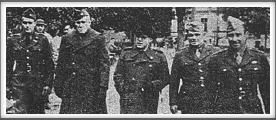 From Red Cross Bulletin 1/45 - 8/45, taken October 17, 1944 
L-r: Lt. Col. John K. Waters, Col. Paul Goode - Senior American Officer, Mr. C. Christiansen - War Prisoners Aid of the YMCA, Lt. Col. W. H. Schaefer, Col. George V. Millet
(If you have an original  of this photo, please contact us.)